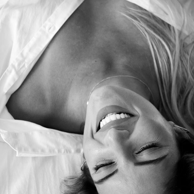 Kaveri Mehta, Lead Design Curator at Meadow Ample River, reviewing corporate floral arrangements